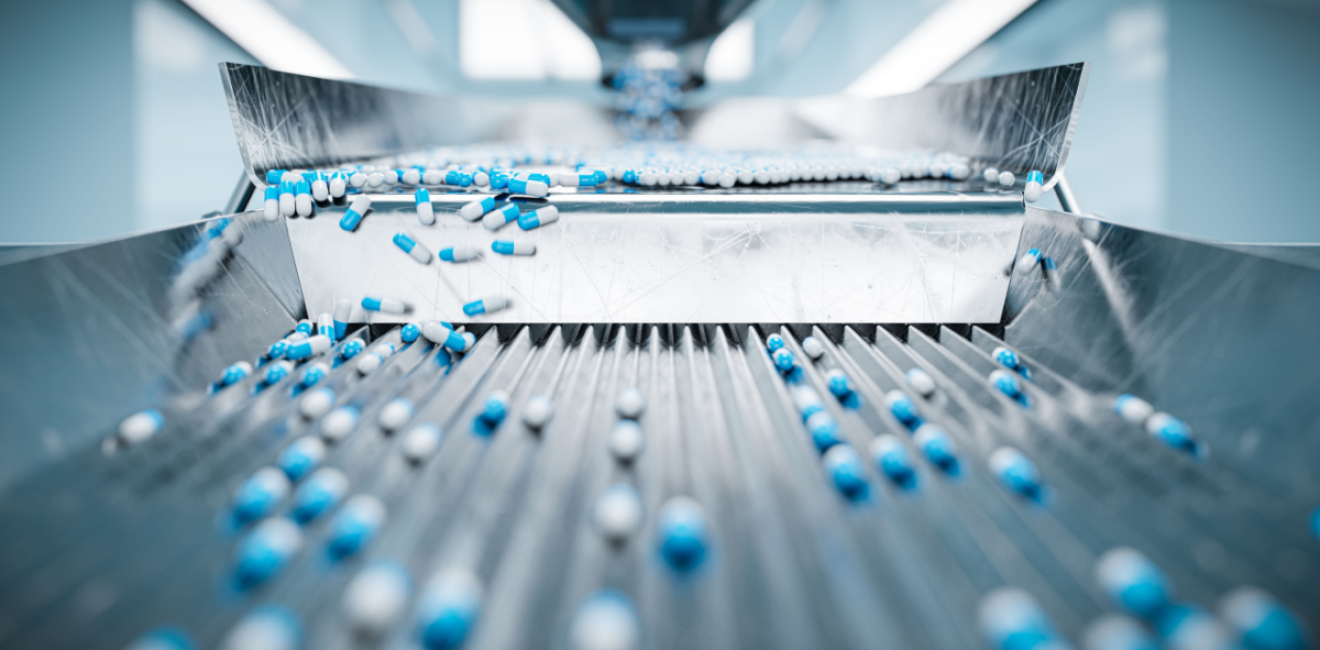 Pharmaceutical capsules on a conveyor belt