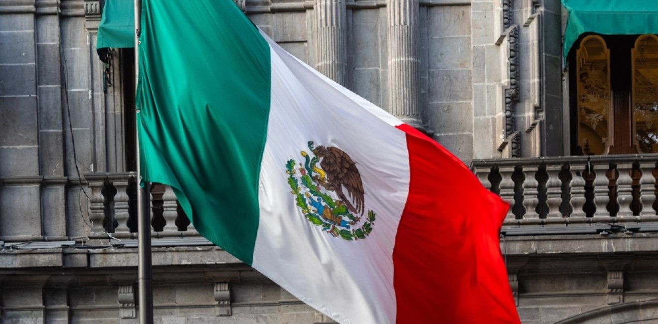 hotel with the flag of Mexico outside, diplomacy hallway of flags.