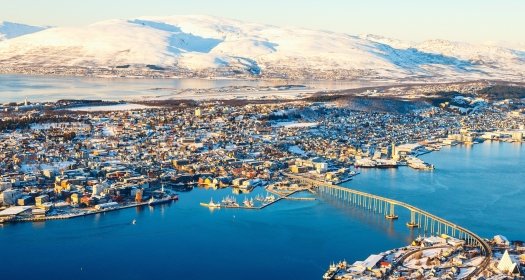 Above view of beautiful winter landscape of snow covered town Tromsoe in Northern Norway