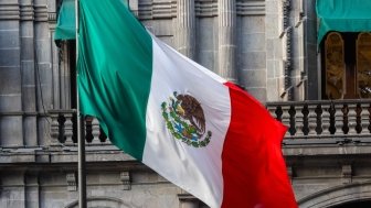 hotel with the flag of Mexico outside, diplomacy hallway of flags.