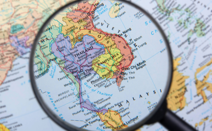 Magnifying glass over map of South East Asia