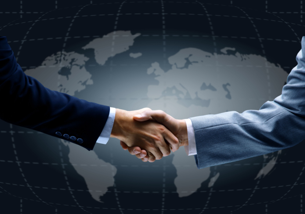 Handshake in front of world map