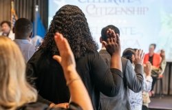 New naturalized US citizen take oath of allegiance at a special naturalization ceremony at New York Public Library on June 30, 2023.