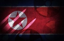 A photo of the North Korean flag with an image of missiles superimposed on top.