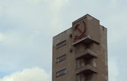 Sickle and hammer on a Soviet building